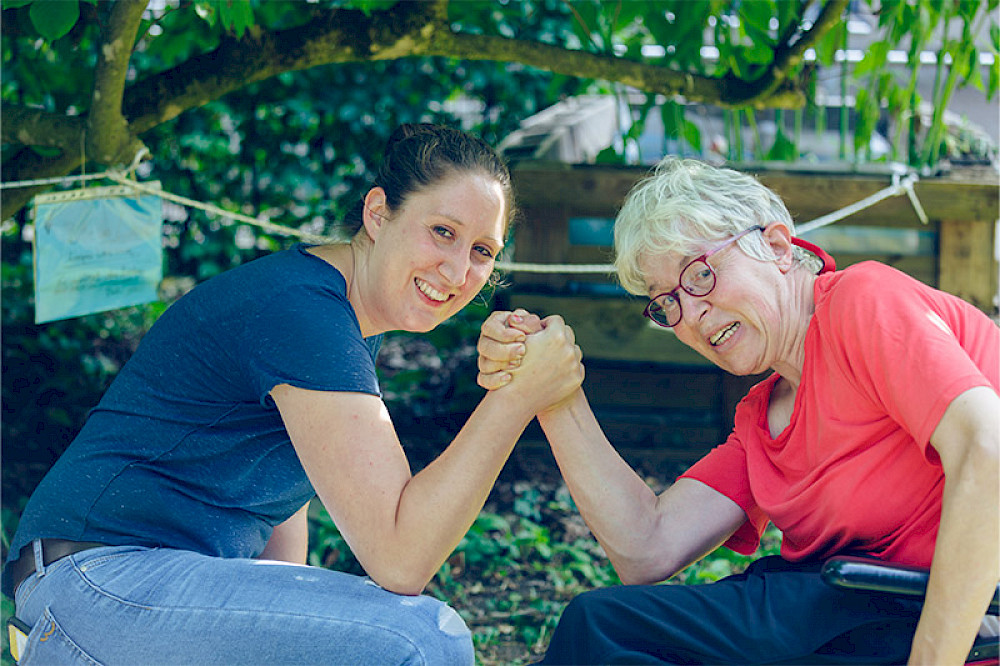 Image shows a younger and an older person.