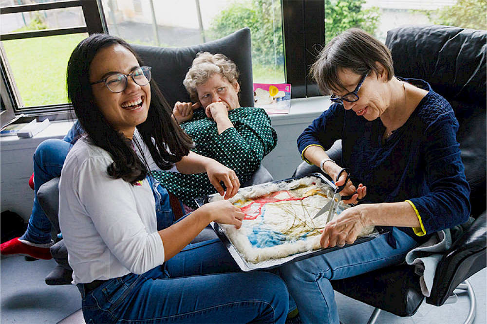 Image shows people laughing together in the ark.